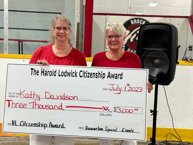 Kathy Davidson (left) receiving her cheque from Linda Bishop